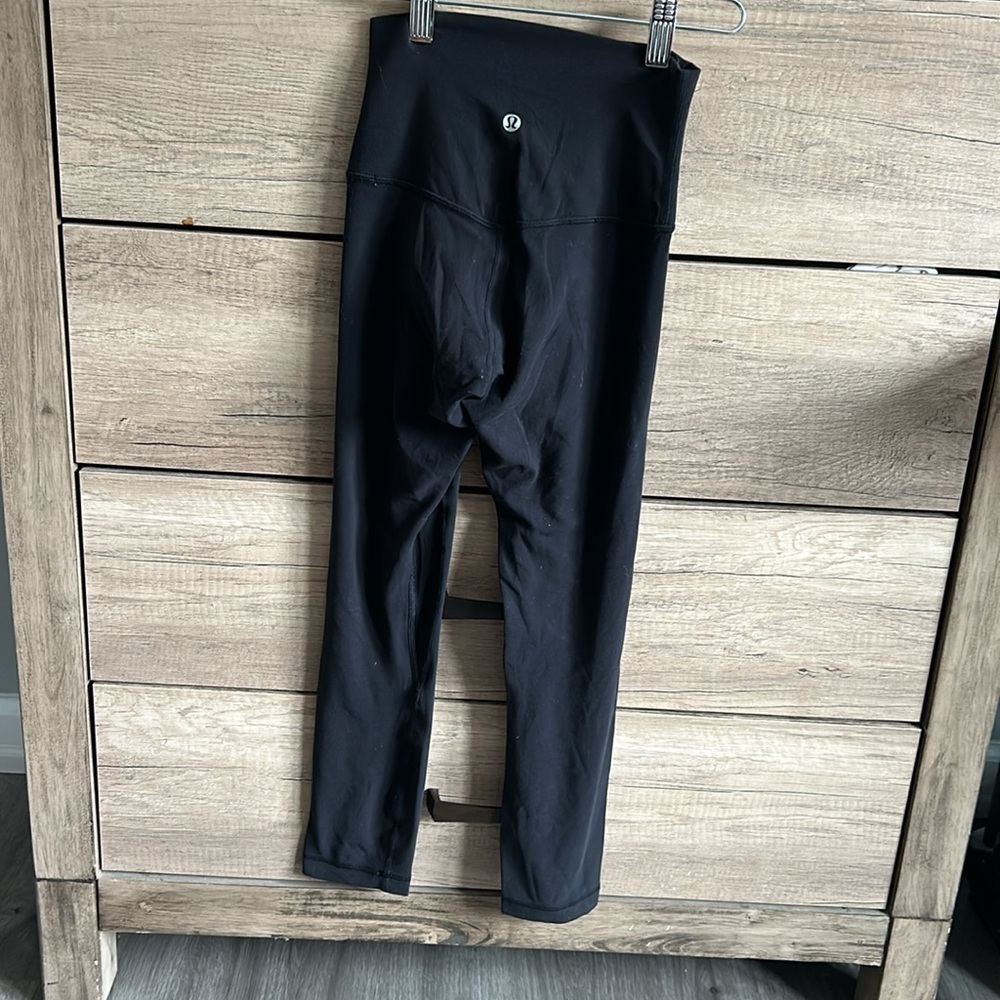 Lululemon Align HR Crop 23 size 0, small hole below right knee.